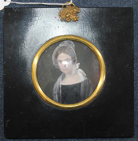 English School c.1870 Miniature of a young lady wearing a lace bonnet, tondo, 2.75in.